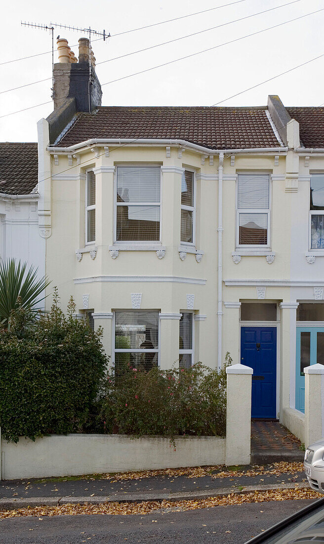 Cream painted terraced East Sussex home, England, UK