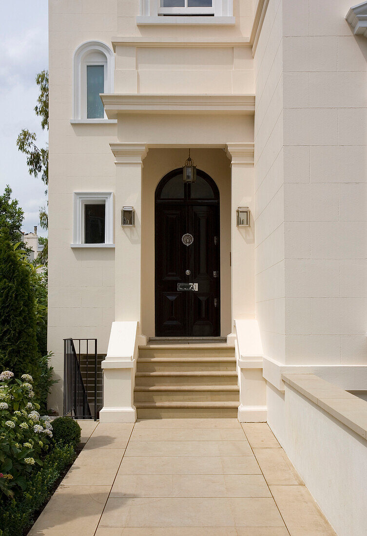 Black front door of London townhouse