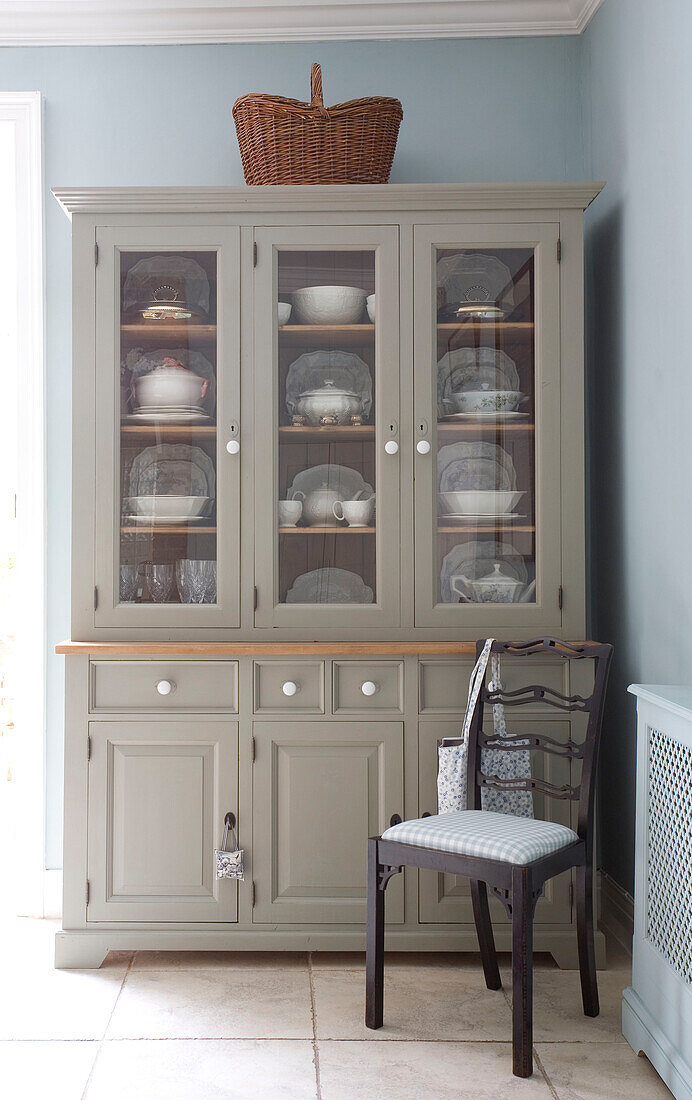 Chair and kitchen dresser in light blue kitchen of Tyne & Wear home, England, UK