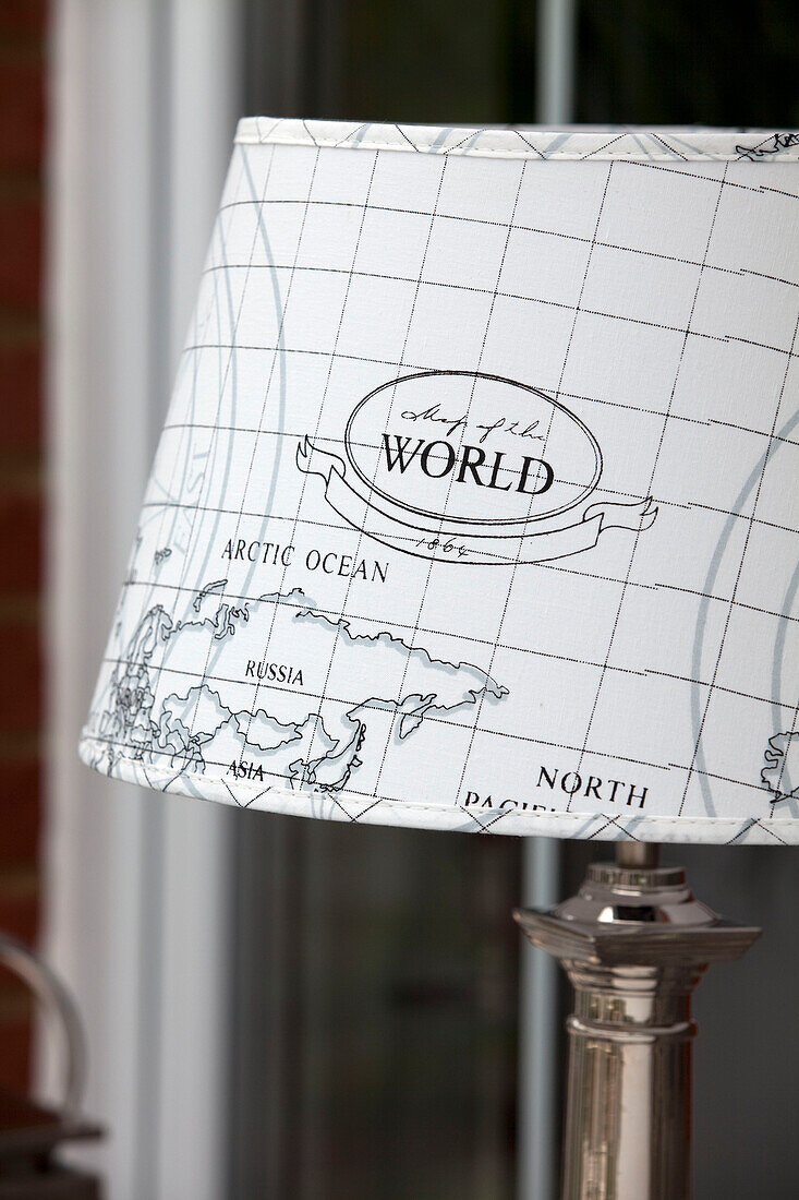 Close up of world map lampshade in Kent cottage, England, UK