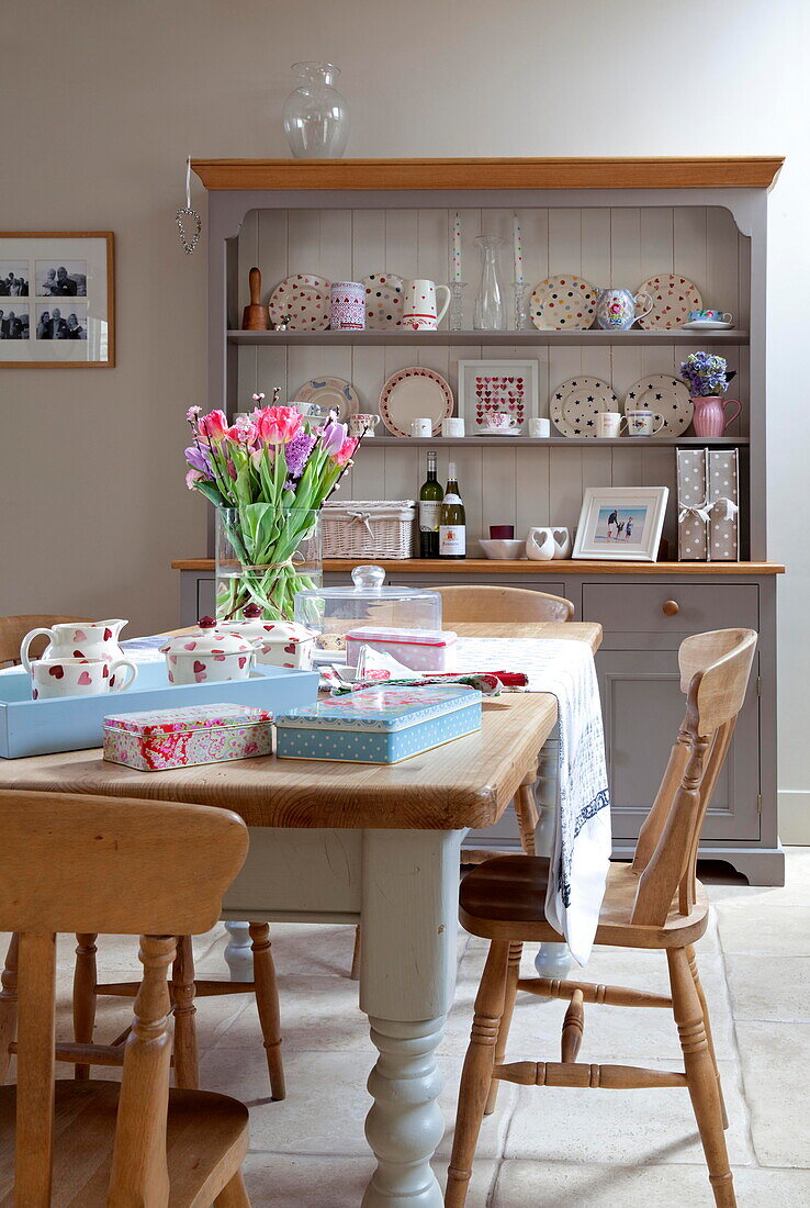 Kitchen dresser and table with tulips Staffordshire farmhouse England UK