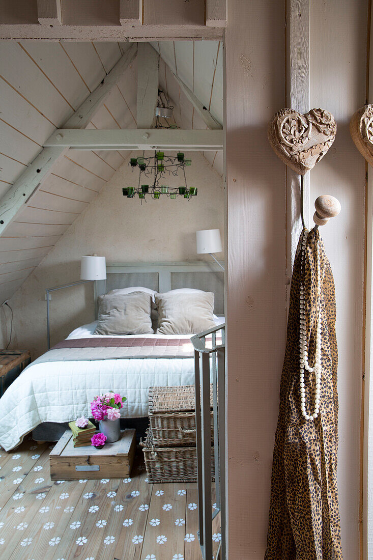 View through doorway to attic bedroom of Brittany cottage, Western France