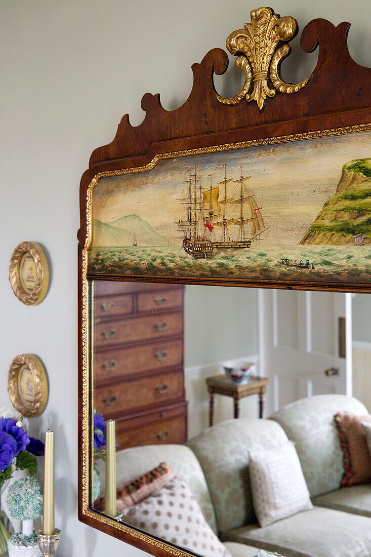 Sofa reflected in antique mirror, Burwash home, East Sussex, England, UK