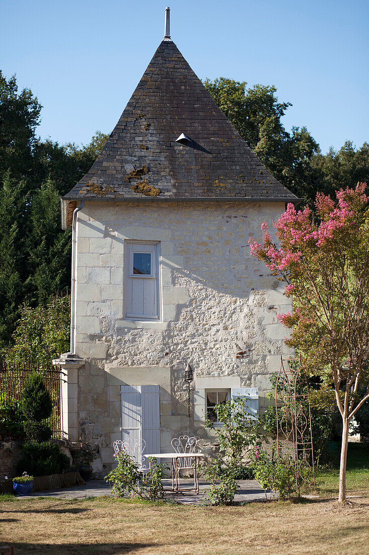 Sunlit exterior of French gatehouse in the Loire, France