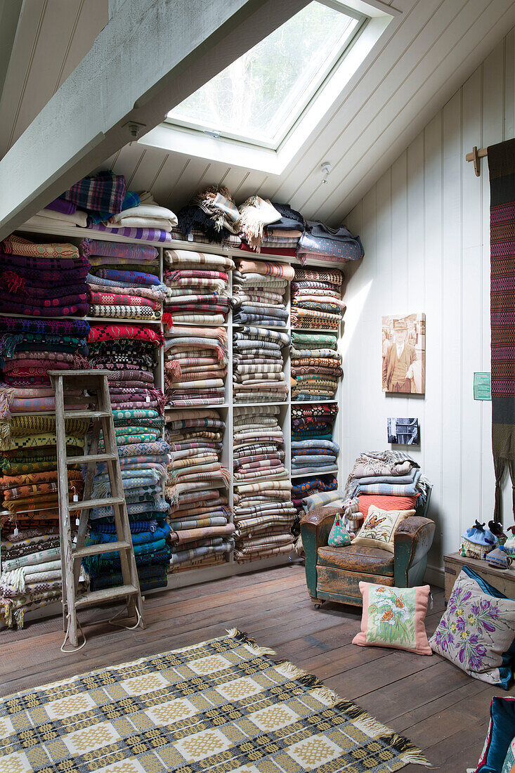 Woollen blankets on storage shelves in Ceredigion shop Wales UK