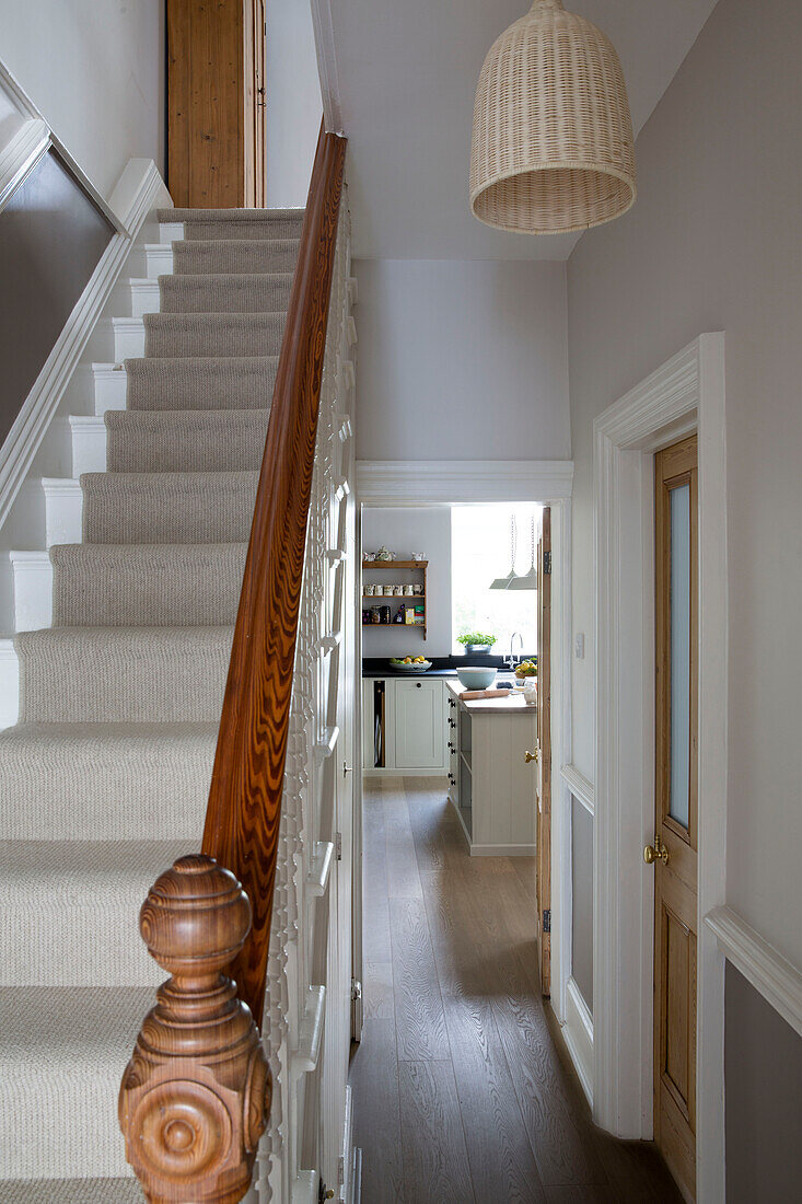 Wooden banister on carpeted staircase in hallway of Shoreham by Sea home   West Susses   England   UK