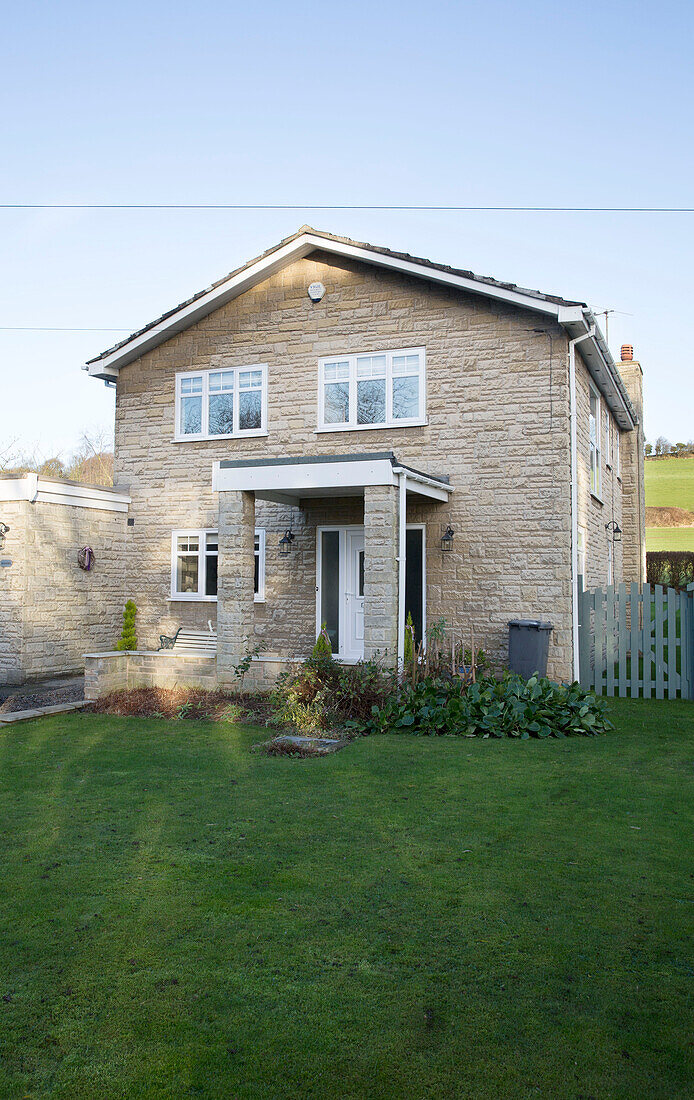 Lawned exterior of 1970s detached Laughton home with porch  Sheffield  UK