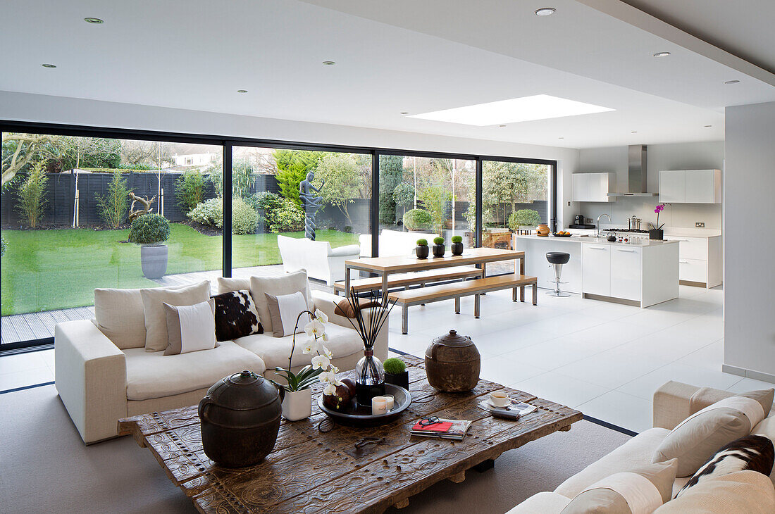 Open plan living room kitchen in zen styled interior of London home,  England,  UK