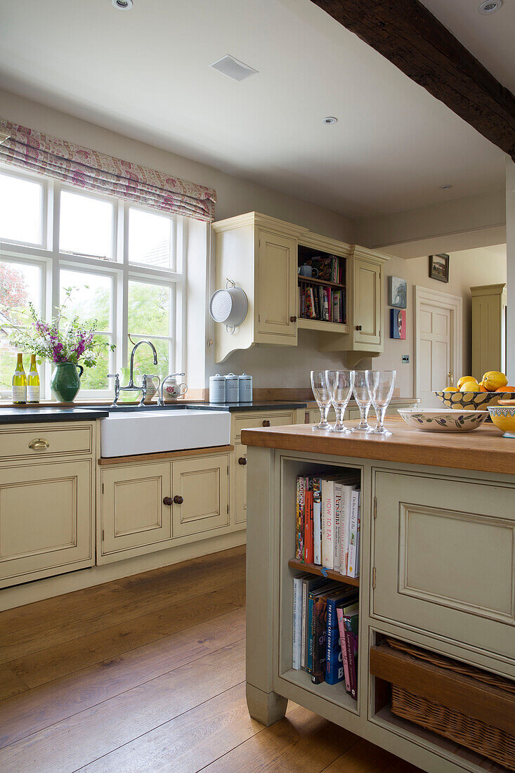 Wineglasses on kitchen island in kitchen of Grade II listed Georgian country house in Shropshire England UK