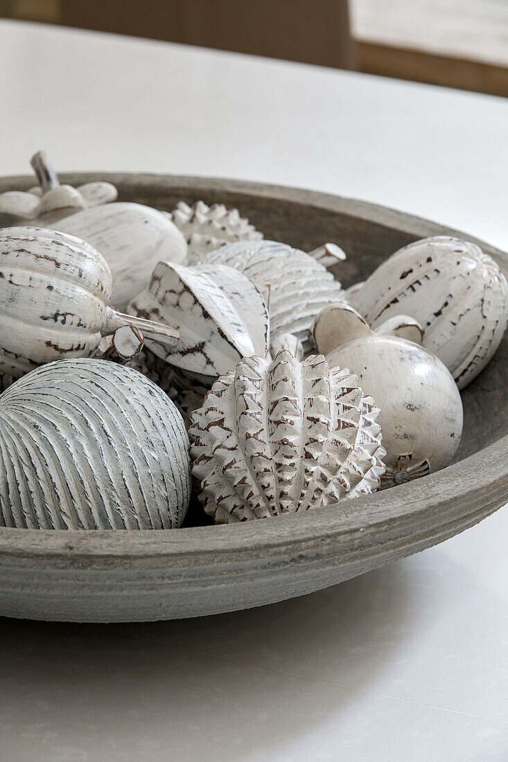 White ornaments in bowl in London townhouse UK