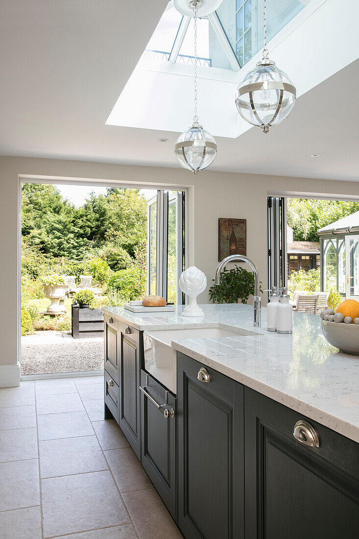 Spacious open plan kitchen with garden view in Sussex UK