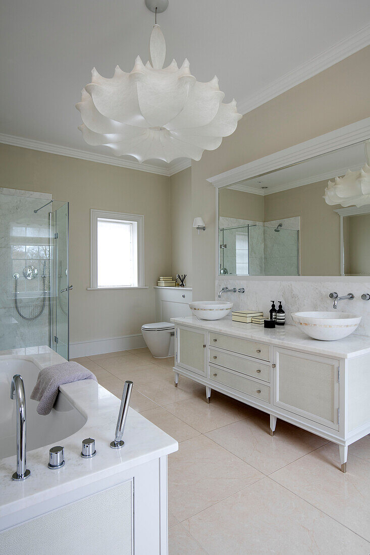 Double basins and large pendant shade in spacious Hampshire bathroom UK