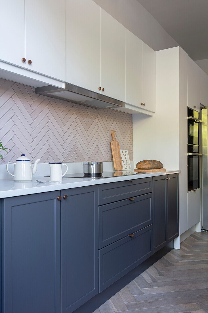 Galley kitchen with oiled parquet floor in Victorian terraced house Manchester UK