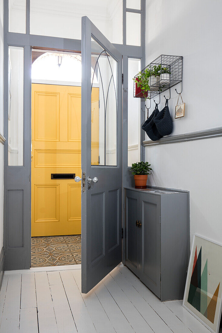 Front door in Babouche with frames in Manor House Gray with Kaleidoscope floor tiles Cumbrian terrace UK