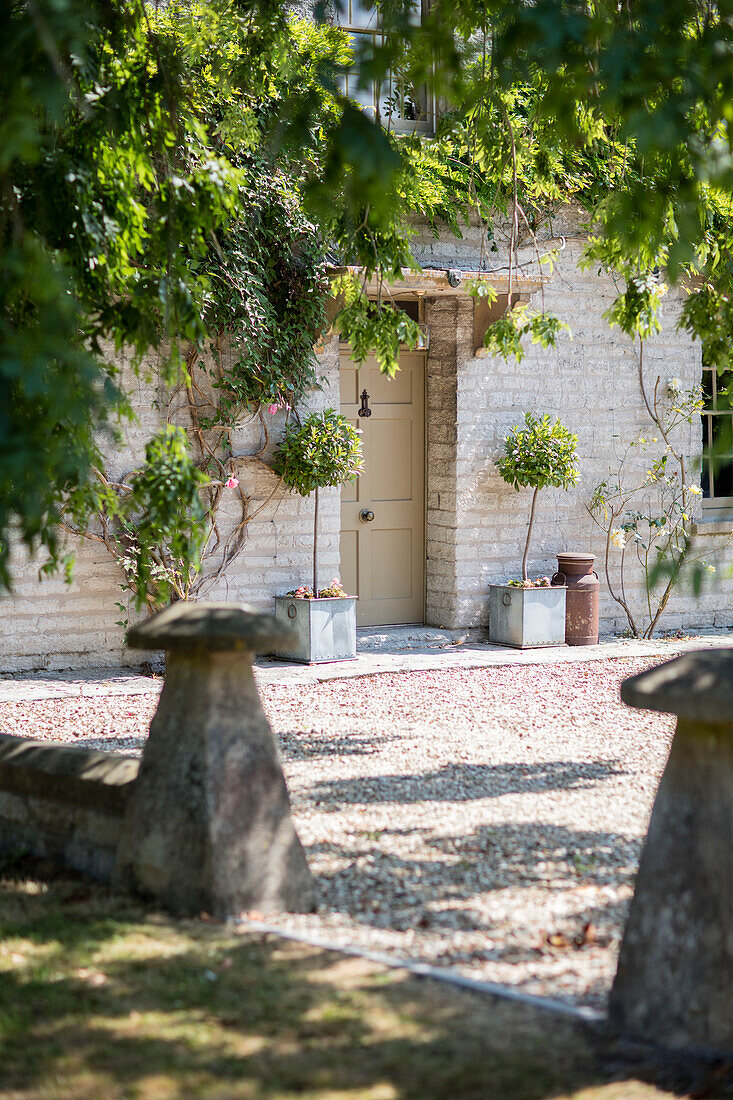 Gravel drive and front door of Grade II listed Georgian farmhouse Somerset, UK