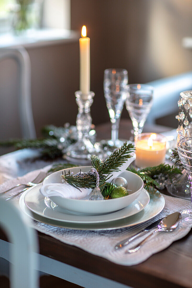 White china personalised place setting with lit candle in Berkshire cottage UK