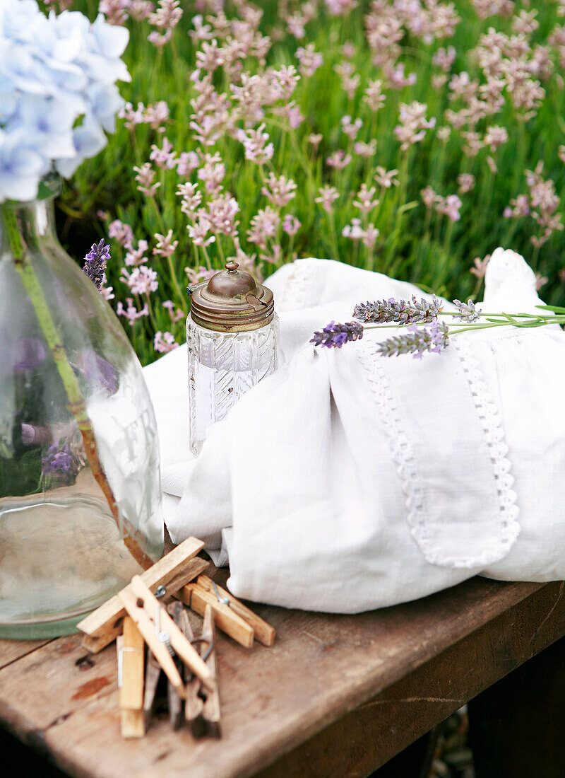 Clothes pegs and linen on table in Isle of Wight garden UK