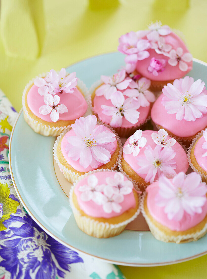 Pink fairycakes decorated with flowers