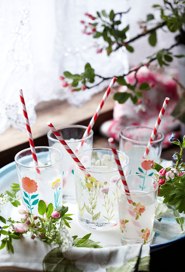 Glasses of lemonade with striped straws