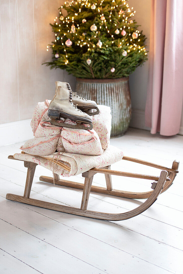 Vintage wooden sledge and ice skates