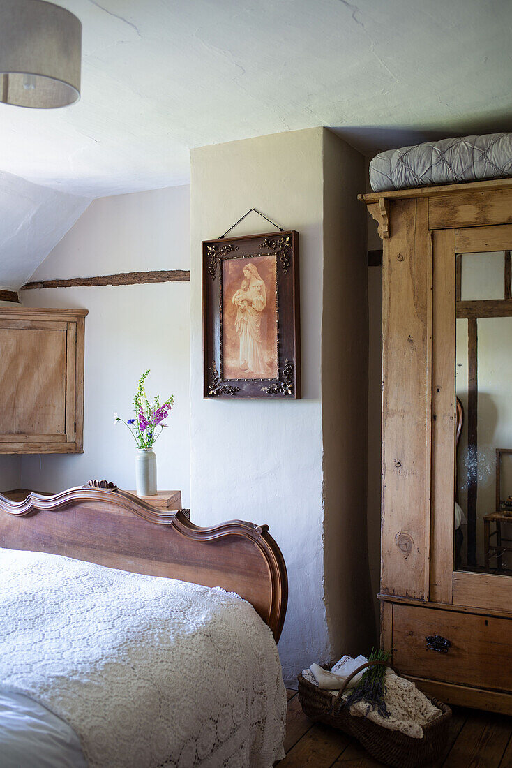 Vintage mother and child photo on wall of Country cottage bedroom