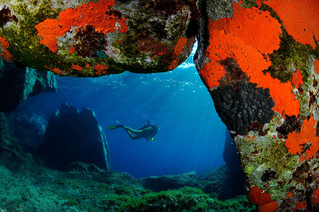 Diver in a cave of Capraia, Italy