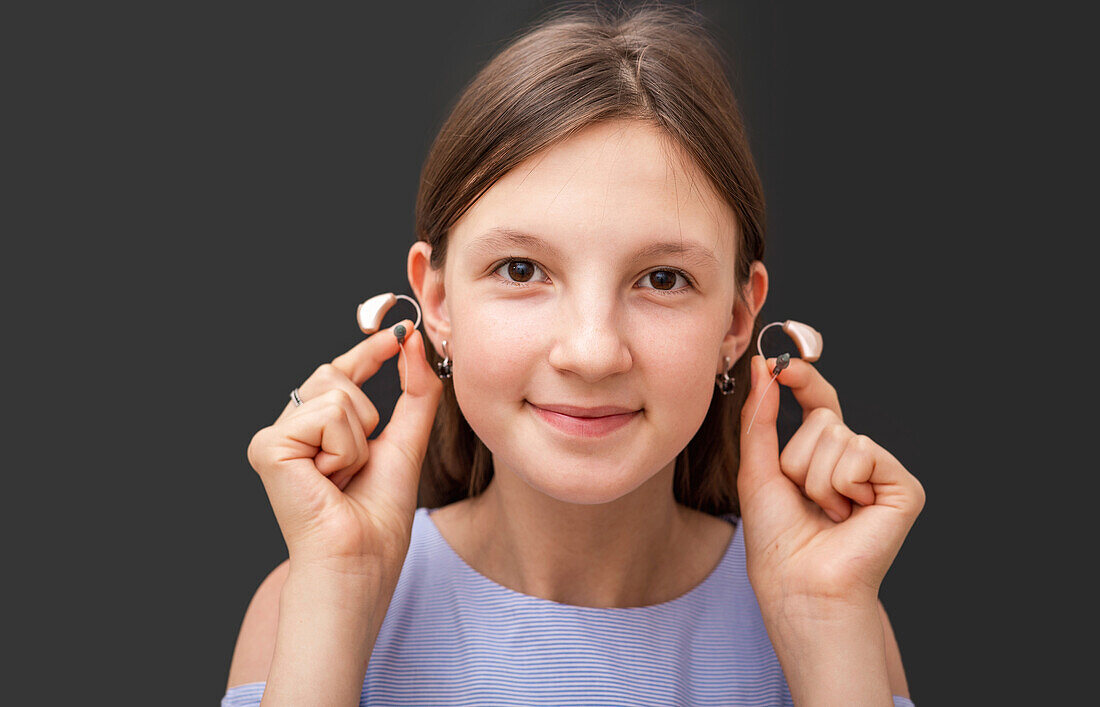 Girl with hearing aid