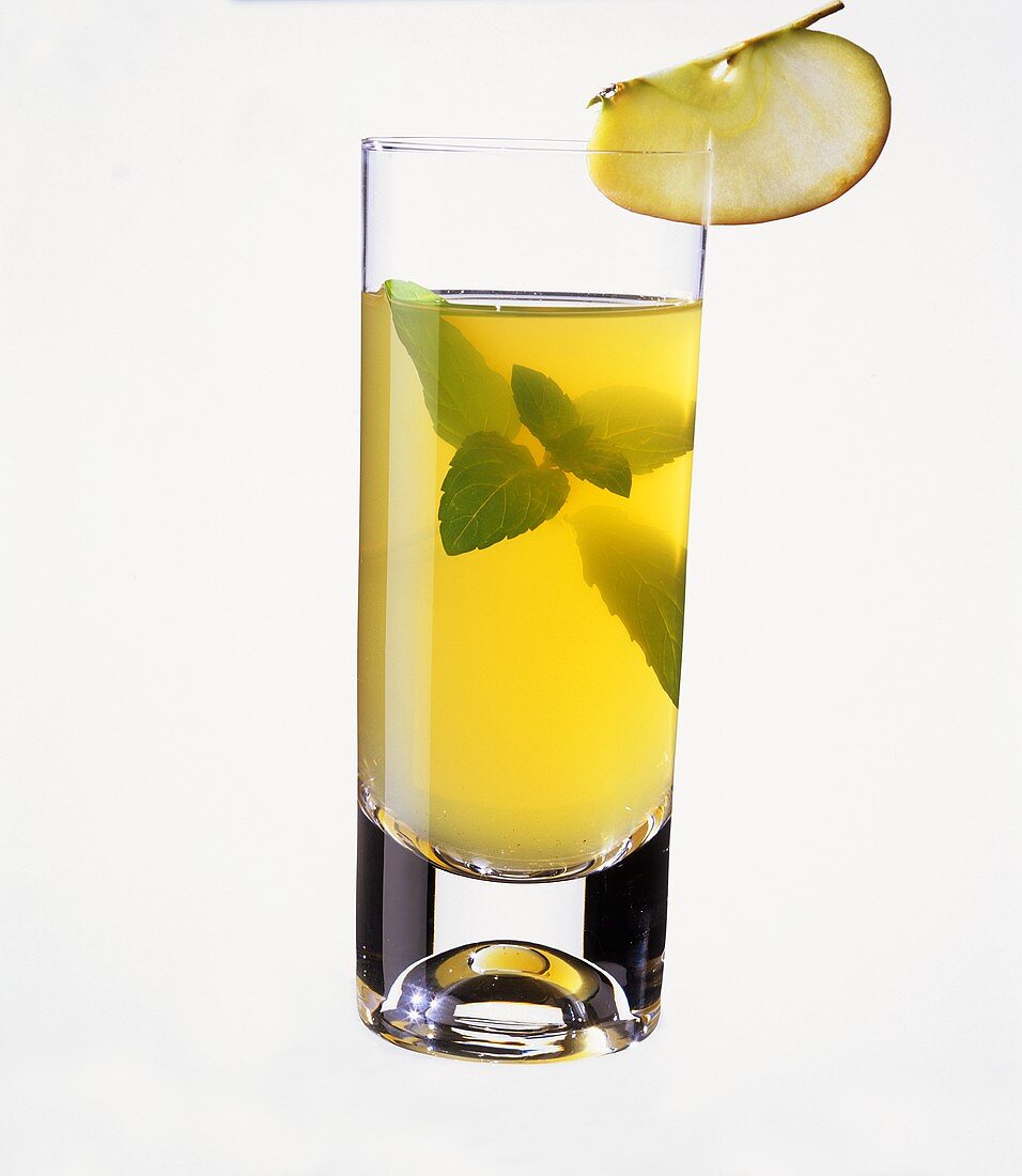 Apple drink in glass with mint leaves