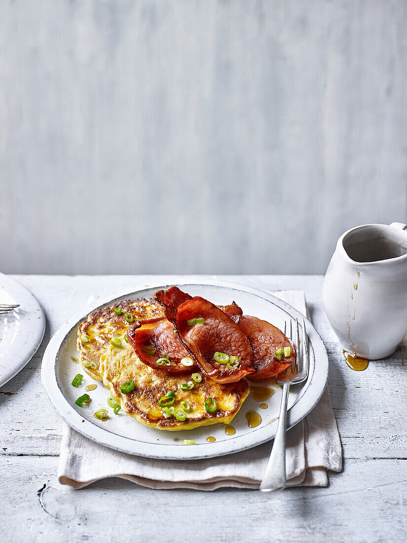 Buttermilk corn pancakes with bacon and maple syrup