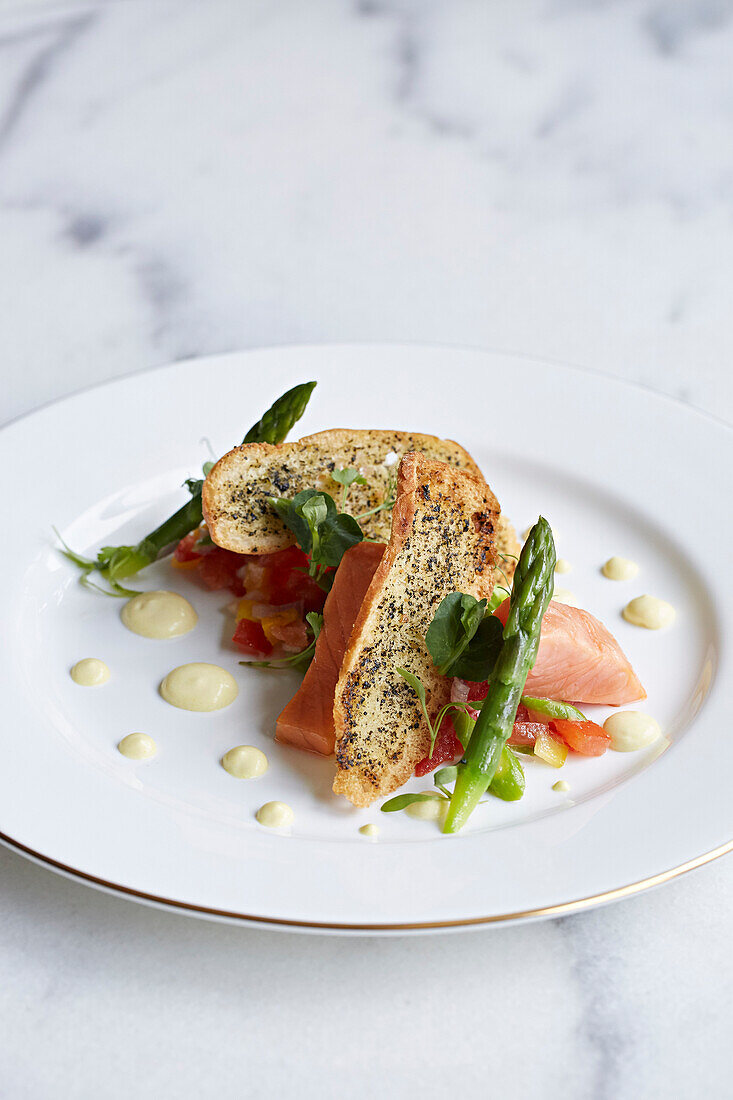 Salmon and asparagus served with crusty bread