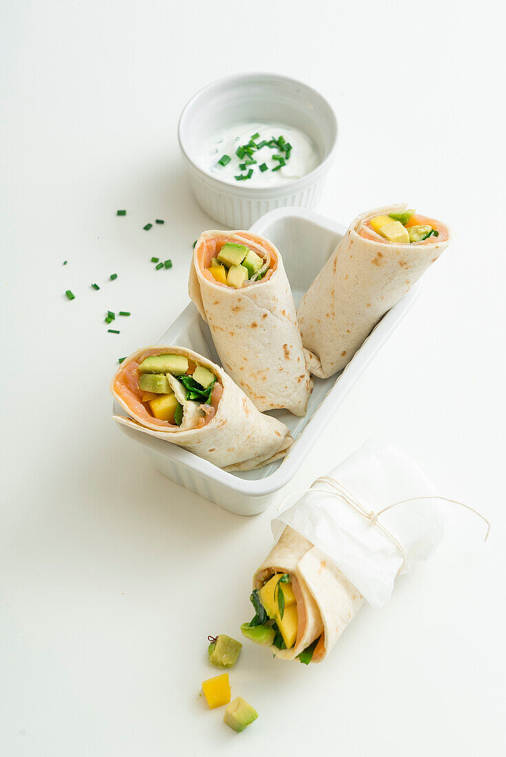 Summer burrito with salmon, mango and avocado