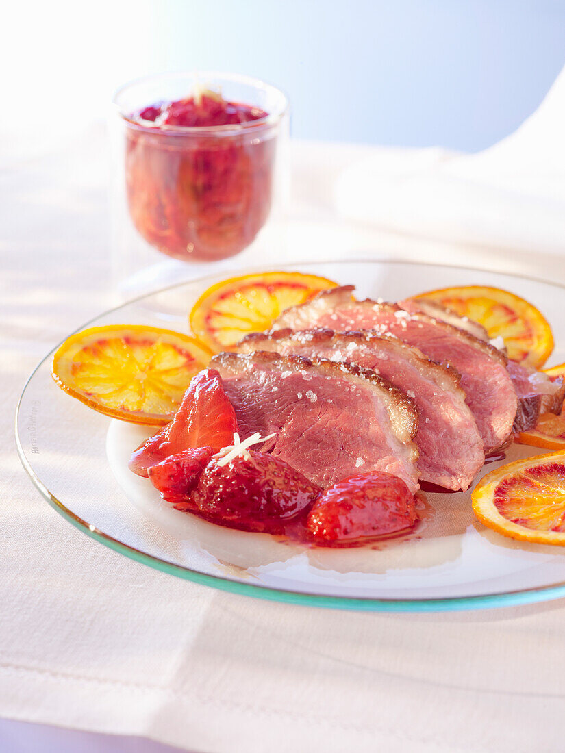 Duck breast with candied orange and strawberries
