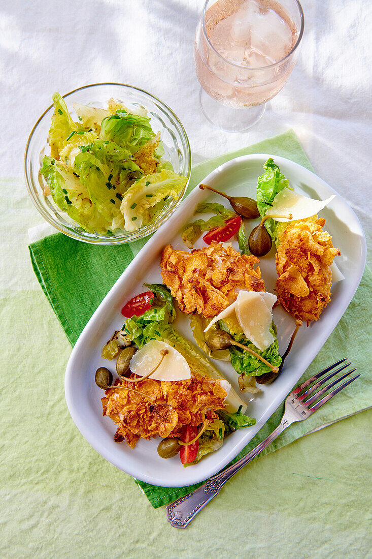 Chicken in cornflake coating with salad