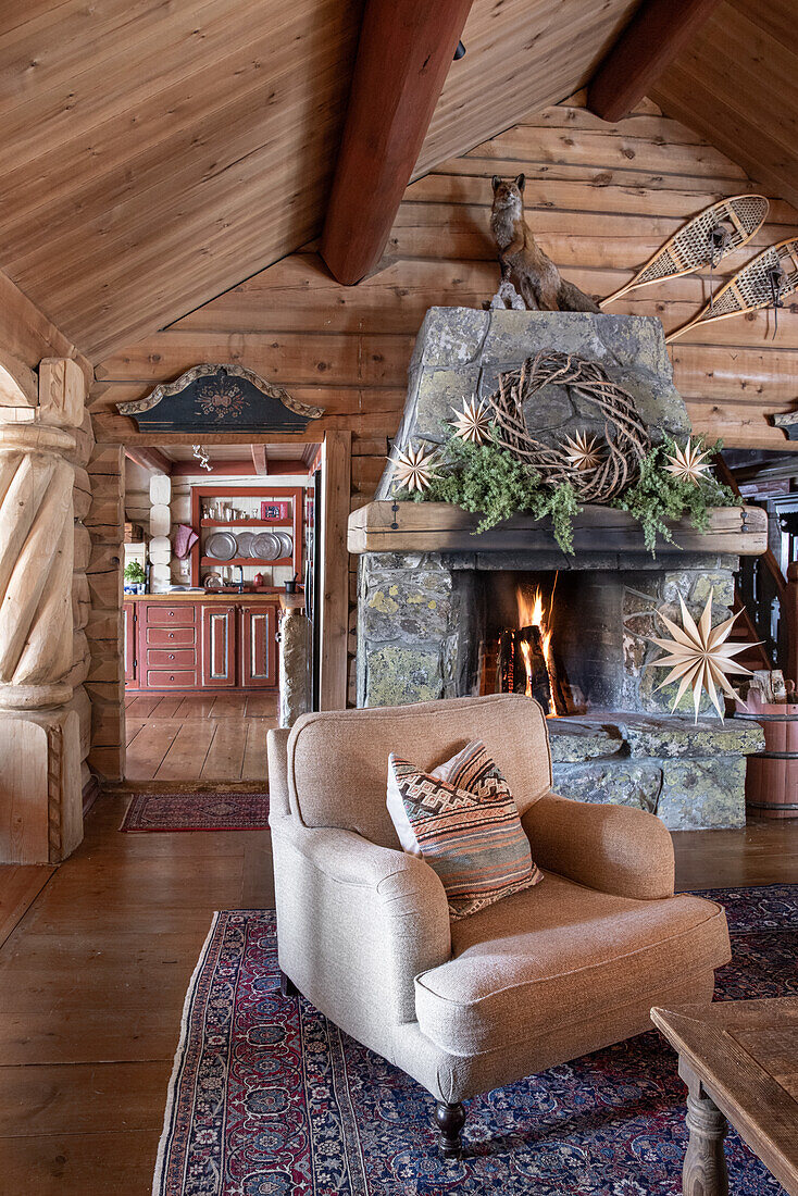 Rustic living room with fireplace and traditional wooden ceiling