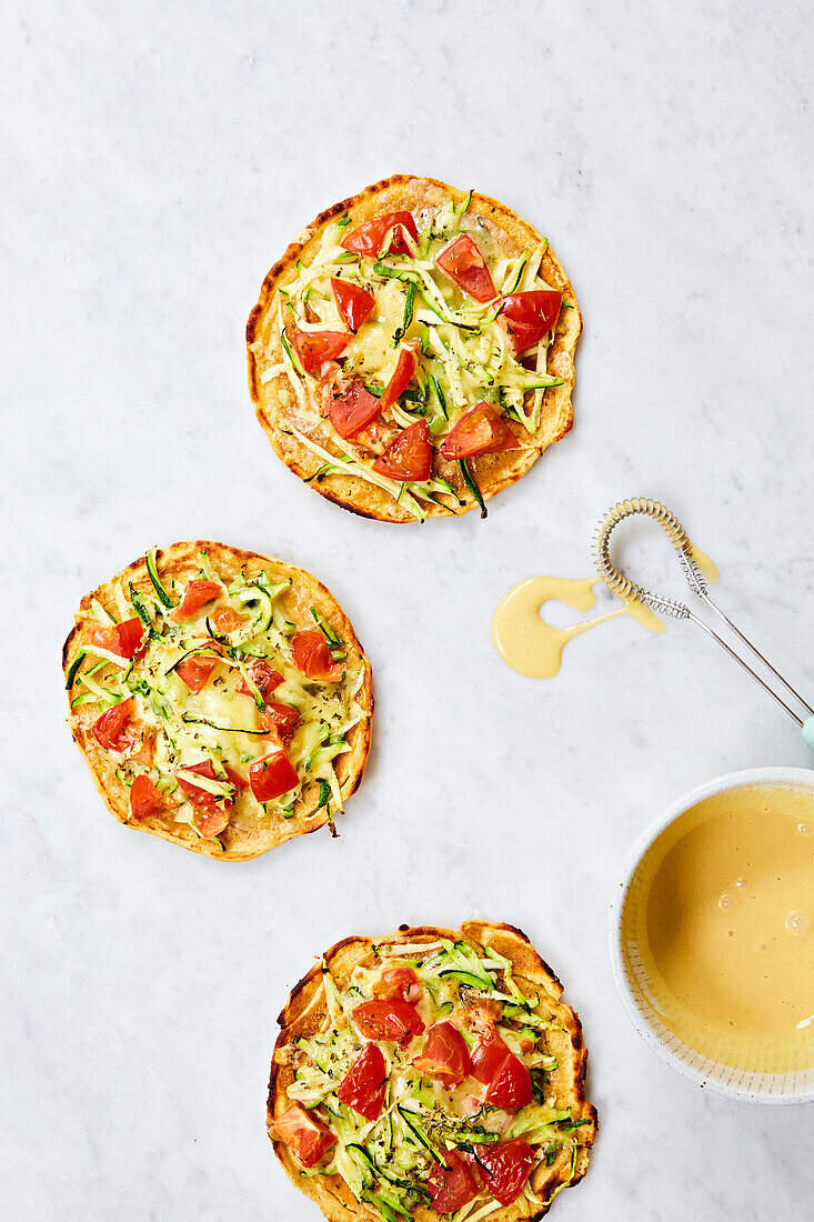 Flatbreads with tomato, courgette and cheese