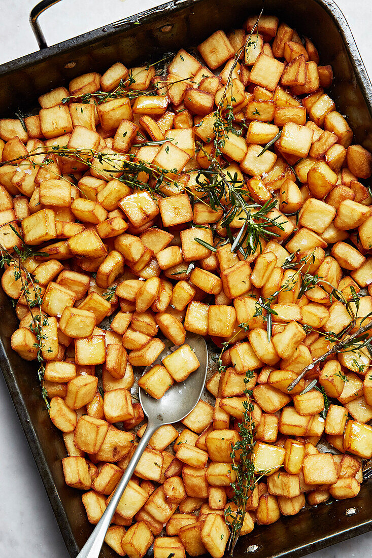 Cubed roast potatoes with rosemary and salt