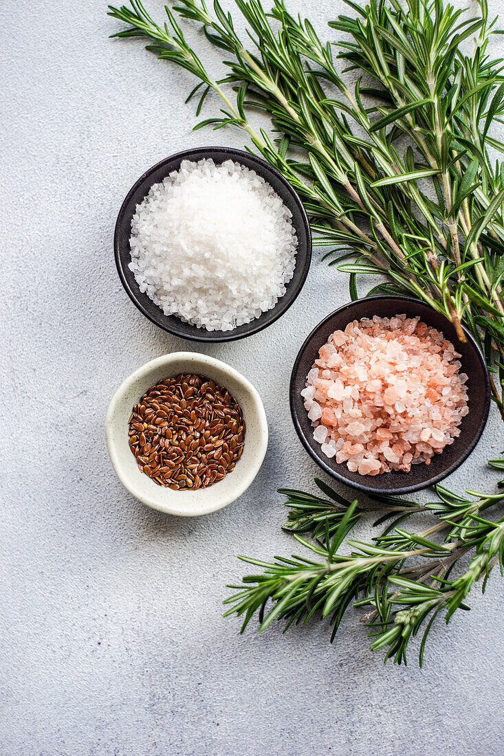 Varieties of salt spice and flax seeds in the bowls