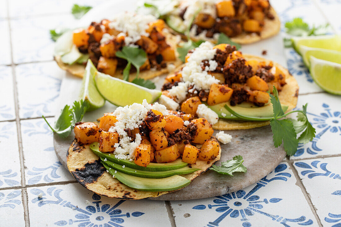 Crispy Potato and Chorizo Tacos with quesco fresco cheese, avocado and cilantro