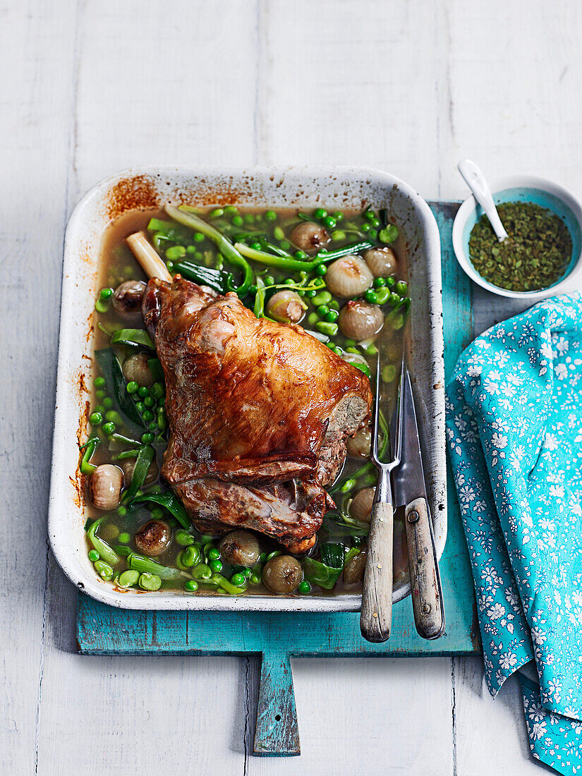 Slow-cooked lamb with spring veg and fresh mint sauce