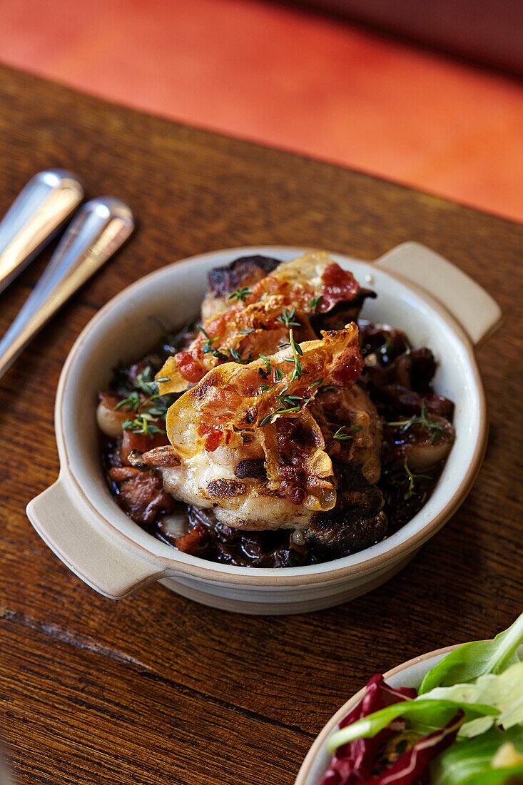 chargrilled chicken with braised wild mushrooms, cipollini onions and guanciale