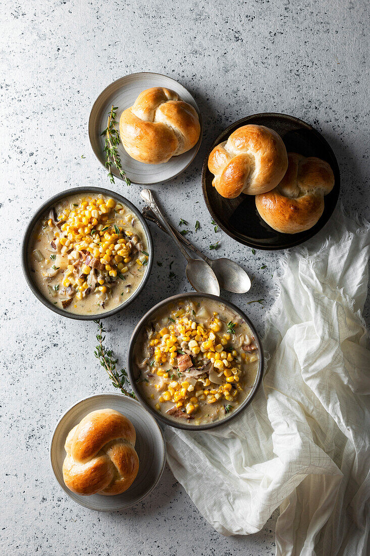 Corn chowder with bread rolls