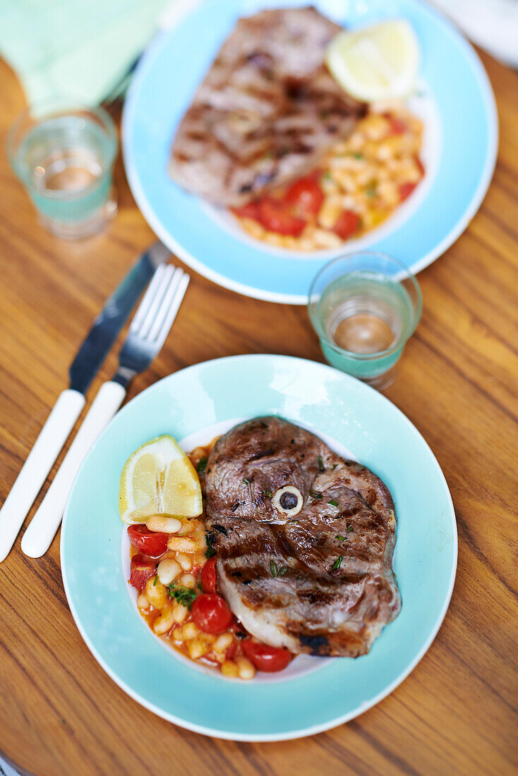 BBQ lamb steaks with garlicky white beans