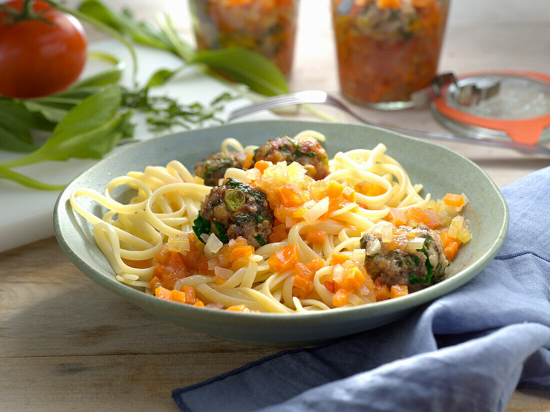 Wild garlic meatballs with tomato sauce with tagliatelle