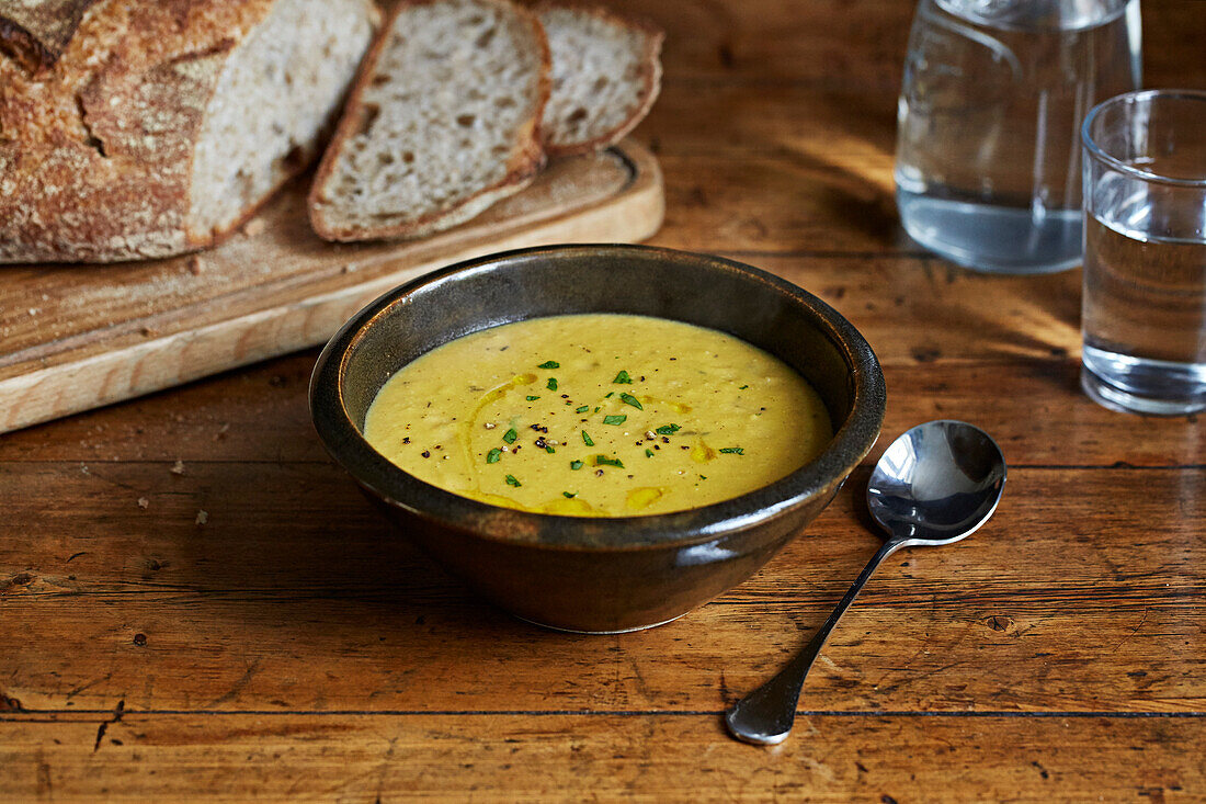 Yellow lentil soup with crispy sourdough bread