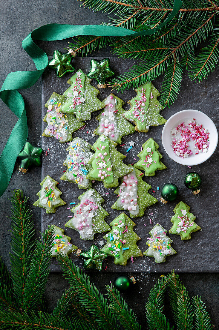 Matcha cookies in the shape of a fir tree with icing for Christmas