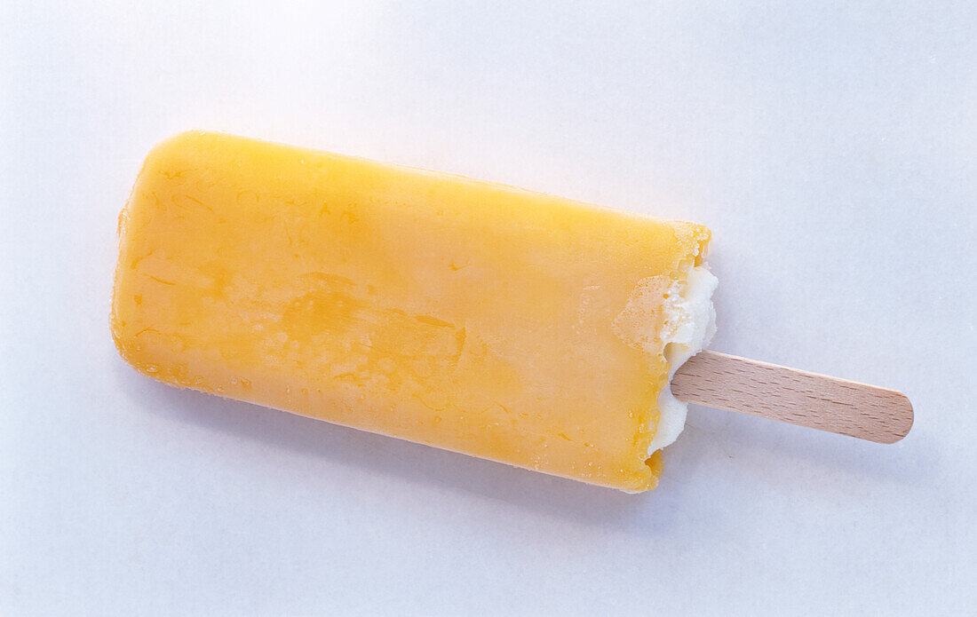 A mango ice cream on a stick
