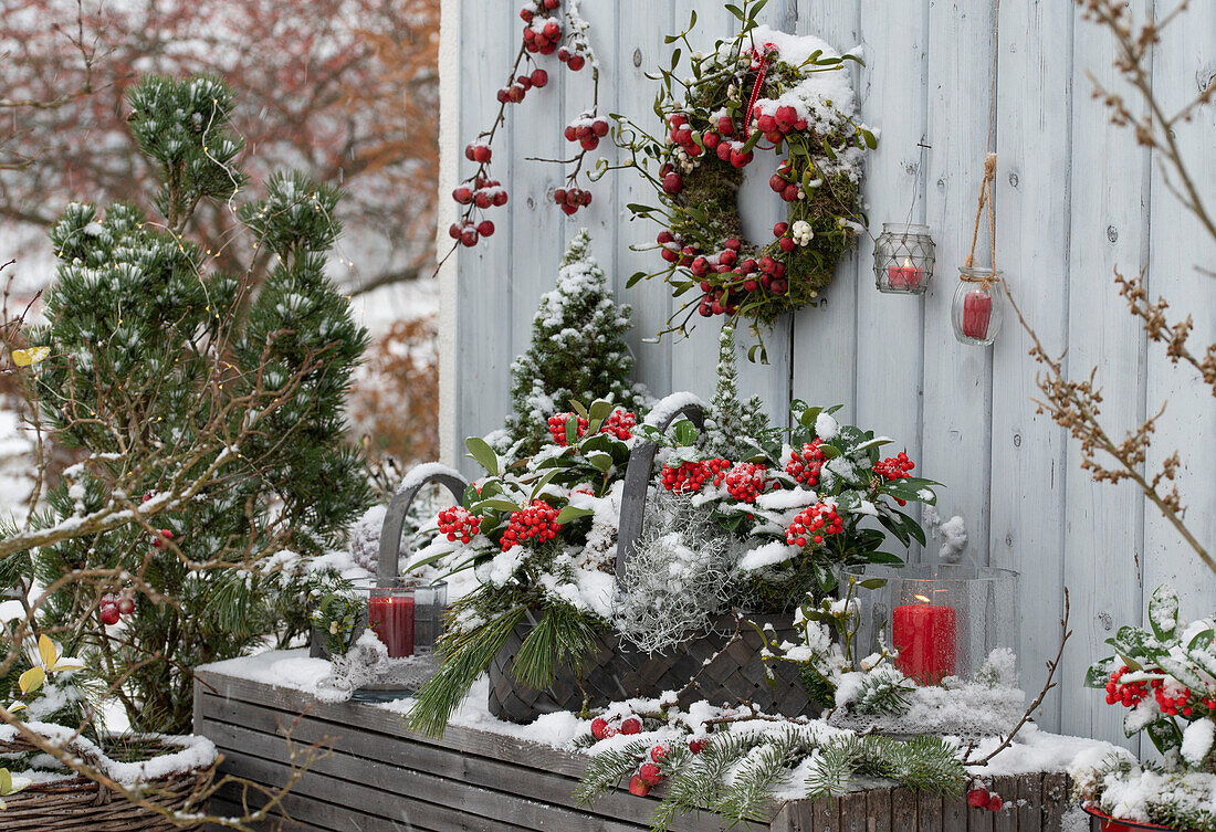 Christmas arrangement with basket, wreath, and lanterns