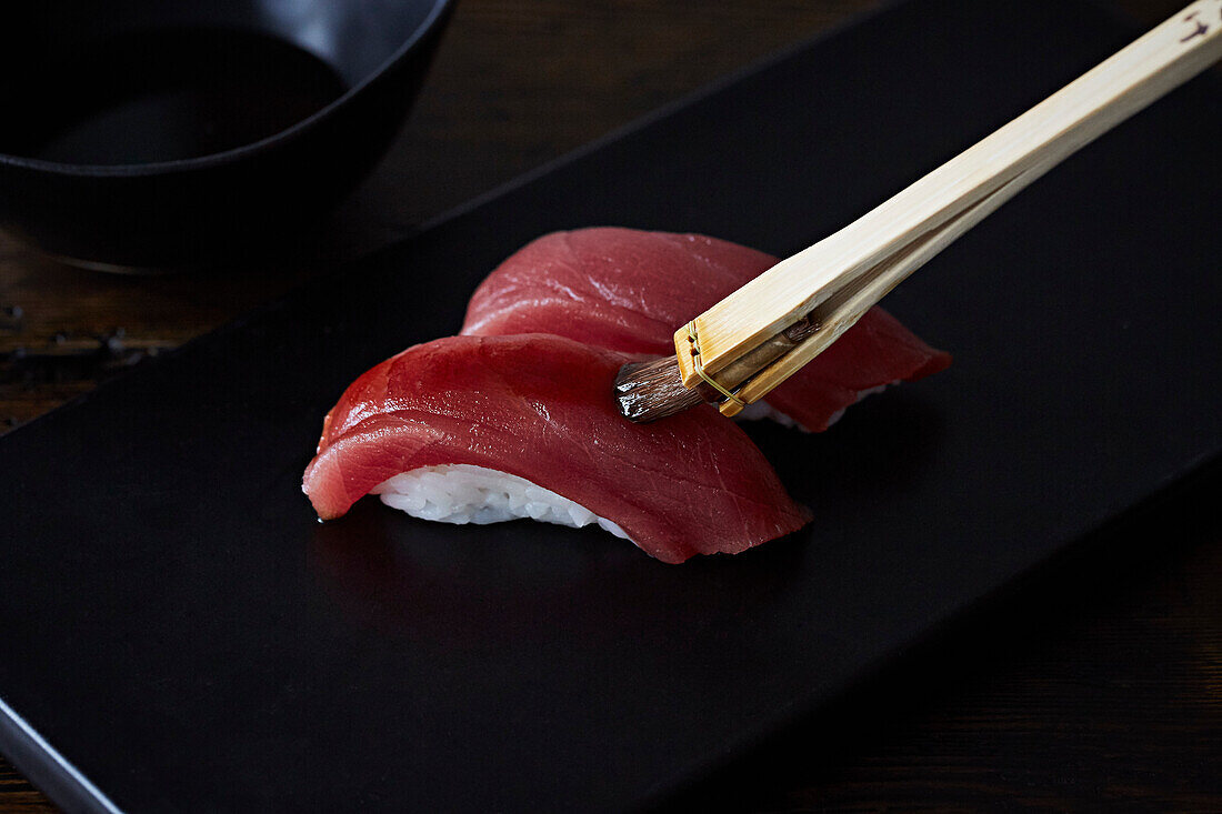 Sashimi being brushed with oil