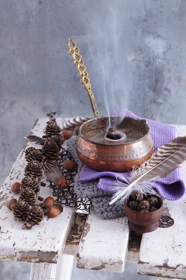 Winter sun incense, homemade incense balls in a copper pan