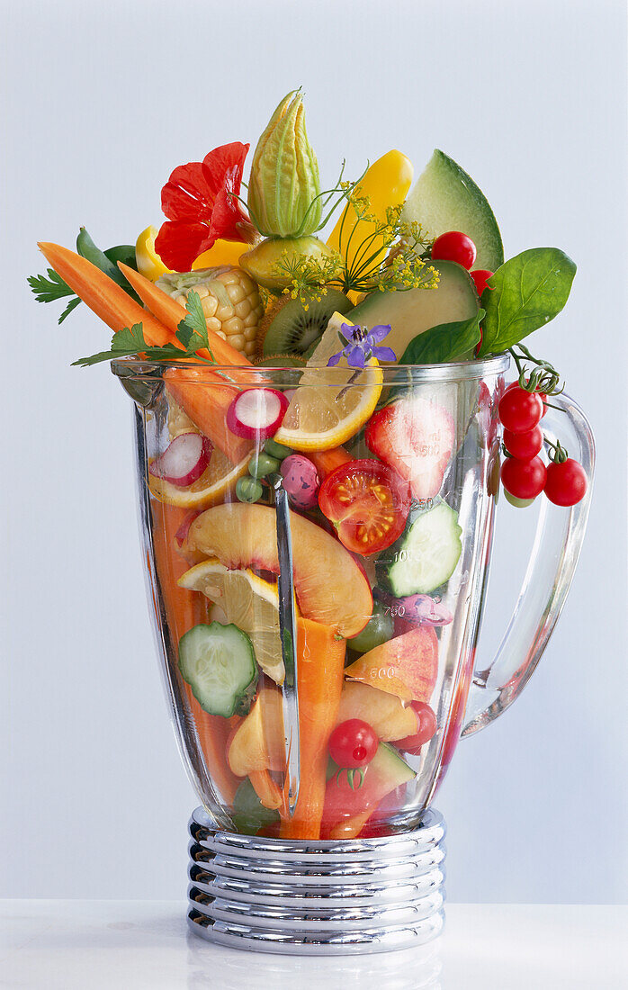 Blender with fresh fruit and vegetables